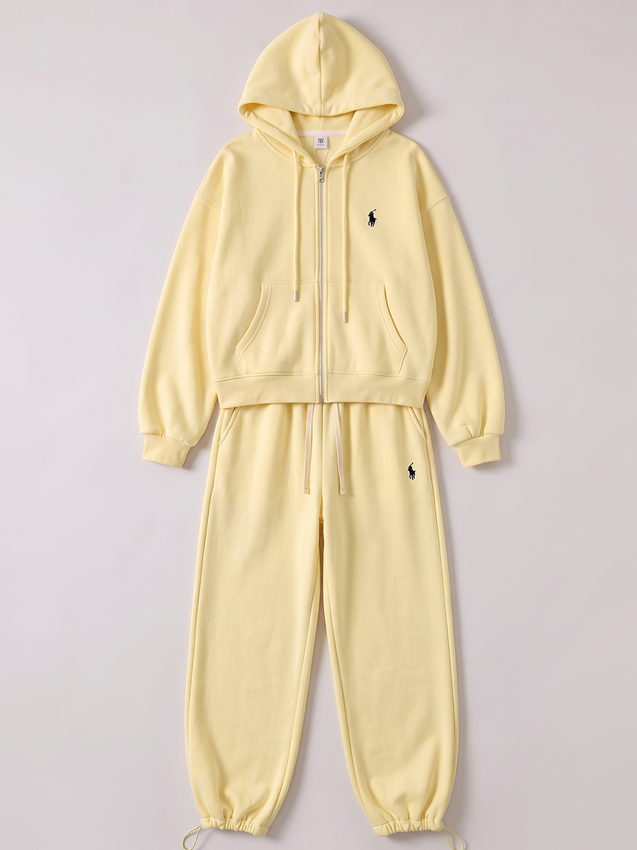 Pale yellow zip hoodie and jogger tracksuit shown flat without a model