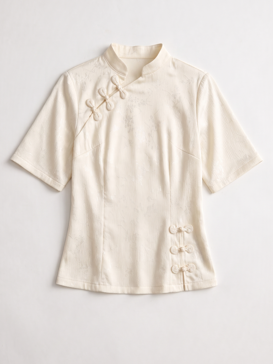Cream mandarin collar blouse shown flat without a model